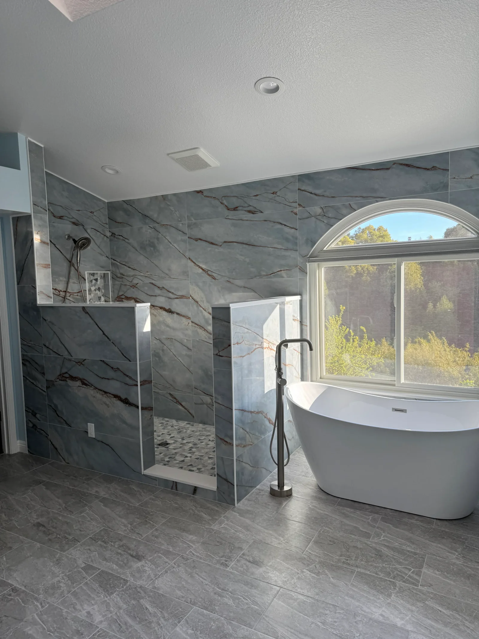 Custom bathroom remodel with tiled shower and finished fixtures
